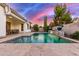 Backyard with covered patio and desert landscaping overlooking a tranquil pool and spa at 3884 S Wilson Dr, Chandler, AZ 85286