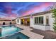 Backyard features a pool, spa, desert landscaping and covered patio with outdoor dining at 3884 S Wilson Dr, Chandler, AZ 85286