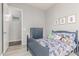 A bedroom featuring a bed with monster truck bedding and framed prints on the wall at 3884 S Wilson Dr, Chandler, AZ 85286