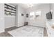 A bonus room featuring shelving, decor, a window, and hardwood flooring at 3884 S Wilson Dr, Chandler, AZ 85286