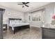Spacious main bedroom with an ensuite bathroom features hardwood floors and neutral paint scheme at 3884 S Wilson Dr, Chandler, AZ 85286