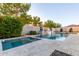 Sparkling backyard pool and spa area with mature landscaping, offering a peaceful retreat for relaxation at 3884 S Wilson Dr, Chandler, AZ 85286