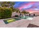 Backyard pool with spa features a rock waterfall feature and desert landscaping at 3884 S Wilson Dr, Chandler, AZ 85286