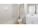 All-white bathroom showcases a bathtub, toilet, and vanity at 4212 E Jasper Dr, Gilbert, AZ 85296