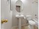 Simple half bath with toilet and pedestal sink at 4212 E Jasper Dr, Gilbert, AZ 85296