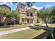 View of a two-story home showcasing architectural details and a green lawn at 4212 E Jasper Dr, Gilbert, AZ 85296