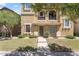 Charming home featuring a quaint balcony and well-manicured front lawn at 4212 E Jasper Dr, Gilbert, AZ 85296