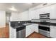 Open kitchen includes stainless steel appliances, granite countertops and wooden floors at 4212 E Jasper Dr, Gilbert, AZ 85296