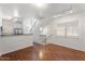 Open-concept living room boasts hardwood floors, staircase access, and natural light at 4212 E Jasper Dr, Gilbert, AZ 85296