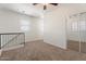 Spacious loft boasts staircase access, carpeted floors, and multiple windows at 4212 E Jasper Dr, Gilbert, AZ 85296