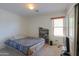Comfortable bedroom features neutral walls, carpet, and a window for natural light at 45138 W Norris Rd, Maricopa, AZ 85139