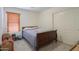 Bedroom with carpet flooring, a window with blinds, and a closet with sliding doors at 45138 W Norris Rd, Maricopa, AZ 85139