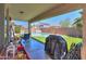 Outdoor living space including a covered patio and artificial grass and yard at 45138 W Norris Rd, Maricopa, AZ 85139