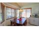 Dining area with a wood table, seating for four, and a window with bright natural light at 45138 W Norris Rd, Maricopa, AZ 85139