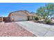 Beautiful home featuring a desert landscape, two-car garage, and tile roof at 45138 W Norris Rd, Maricopa, AZ 85139