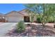 Charming single-story home featuring desert landscaping and a two-car garage at 45138 W Norris Rd, Maricopa, AZ 85139