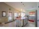 Modern kitchen featuring a center island, stainless steel appliances, and ample storage at 45138 W Norris Rd, Maricopa, AZ 85139