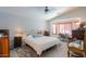 Spacious main bedroom with vaulted ceiling, desk, and a window for natural light at 45138 W Norris Rd, Maricopa, AZ 85139