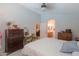 Comfortable main bedroom with a glimpse into the dining room and bathroom at 45138 W Norris Rd, Maricopa, AZ 85139