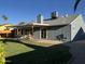Backyard exterior featuring a covered patio and lush green lawn at 4608 W Gail Dr, Chandler, AZ 85226