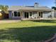Backyard featuring a covered patio and well-maintained lawn at 4608 W Gail Dr, Chandler, AZ 85226