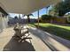 Covered patio featuring outdoor seating area overlooking the manicured backyard at 4608 W Gail Dr, Chandler, AZ 85226