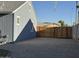 Side yard exterior featuring gravel, manicured landscaping, and a wood fence at 4608 W Gail Dr, Chandler, AZ 85226