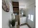 Bright bathroom featuring a marble vanity, built in shelving and beach themed decor at 4608 W Gail Dr, Chandler, AZ 85226