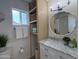 Bright bathroom featuring a marble vanity, built in shelving and beach themed decor at 4608 W Gail Dr, Chandler, AZ 85226