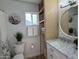 Bright bathroom featuring a marble vanity, built in shelving and beach themed decor at 4608 W Gail Dr, Chandler, AZ 85226