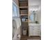 Bright bathroom featuring a marble vanity, built in shelving and beach themed decor at 4608 W Gail Dr, Chandler, AZ 85226