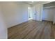 Bedroom with wood-look floors and doors to other rooms at 4608 W Gail Dr, Chandler, AZ 85226