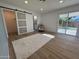 Spacious bedroom with wood-look floors, plush rug, and access to backyard at 4608 W Gail Dr, Chandler, AZ 85226