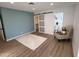 This primary bedroom has wood-look floors, an ensuite, and a walk-in closet at 4608 W Gail Dr, Chandler, AZ 85226