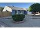 Well-kept home showcasing a tidy front yard with gravel landscaping and a mature shade tree at 4608 W Gail Dr, Chandler, AZ 85226
