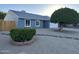 Charming home featuring a well-maintained front yard with mature trees and decorative rock landscaping at 4608 W Gail Dr, Chandler, AZ 85226