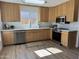 Spacious kitchen with quartz countertops, stainless appliances and wood cabinets at 4608 W Gail Dr, Chandler, AZ 85226