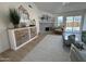 Inviting living room featuring a decorative fireplace, stylish console and sliding glass doors to the backyard at 4608 W Gail Dr, Chandler, AZ 85226