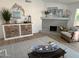 Living room with decorative fireplace, built in cabinet and beach themed decor at 4608 W Gail Dr, Chandler, AZ 85226