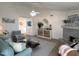 Spacious living room features stylish decor, fireplace, cozy seating, and an open layout perfect for relaxation at 4608 W Gail Dr, Chandler, AZ 85226