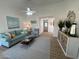 Open living room with stylish décor, comfortable seating, and view of the entry and front door at 4608 W Gail Dr, Chandler, AZ 85226