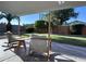 Covered patio with rocking chairs overlooking the well-maintained backyard at 4608 W Gail Dr, Chandler, AZ 85226
