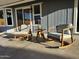 Covered patio featuring outdoor seating area with rocking chairs and small table at 4608 W Gail Dr, Chandler, AZ 85226