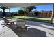 Covered patio with rocking chairs overlooking the well-maintained backyard at 4608 W Gail Dr, Chandler, AZ 85226