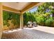 Tranquil backyard with desert landscaping, paved patio, and a built-in outdoor grill at 5234 E Carol Ave, Mesa, AZ 85206