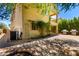 Backyard showcasing brick patio, built-in outdoor grill and access to upper level balcony at 5234 E Carol Ave, Mesa, AZ 85206