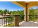 Private balcony with black iron railing and views of neighborhood greenery at 5234 E Carol Ave, Mesa, AZ 85206