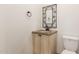 Powder bathroom offers a granite countertop and decorative mirror at 5234 E Carol Ave, Mesa, AZ 85206