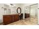 This primary bathroom features dual vanities, granite counters, and a large soaking tub at 5234 E Carol Ave, Mesa, AZ 85206