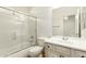 This charming bathroom features a shower-tub combo, tile flooring, and a vanity sink at 5234 E Carol Ave, Mesa, AZ 85206